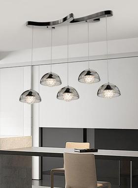 Its a very simple chandelier for a modern, congenial bar wi