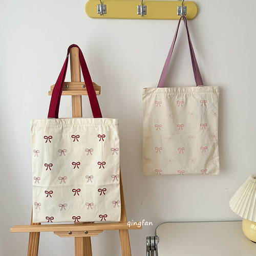 韩系蝴蝶结印花单肩包包女大容量托特包百搭文艺帆布包学生书袋
