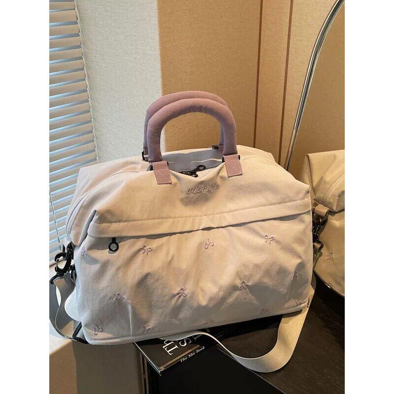 日本进口大容量装衣服行李包旅游手提短途出差旅行包健身包轻便