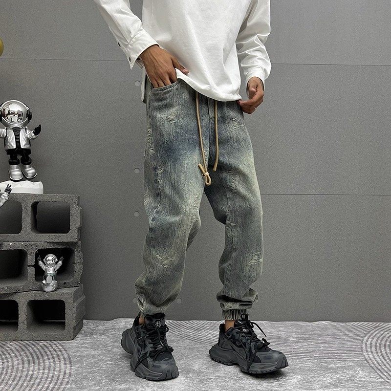 潮流时尚磨破牛仔裤男士秋季新款束脚九分休闲裤痞帅潮牌哈伦裤潮