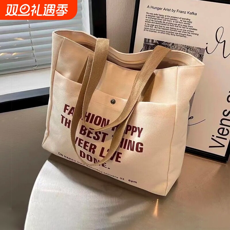 帆布包2024新款大容量女设计师托特包上班通勤学生手提收纳购物袋