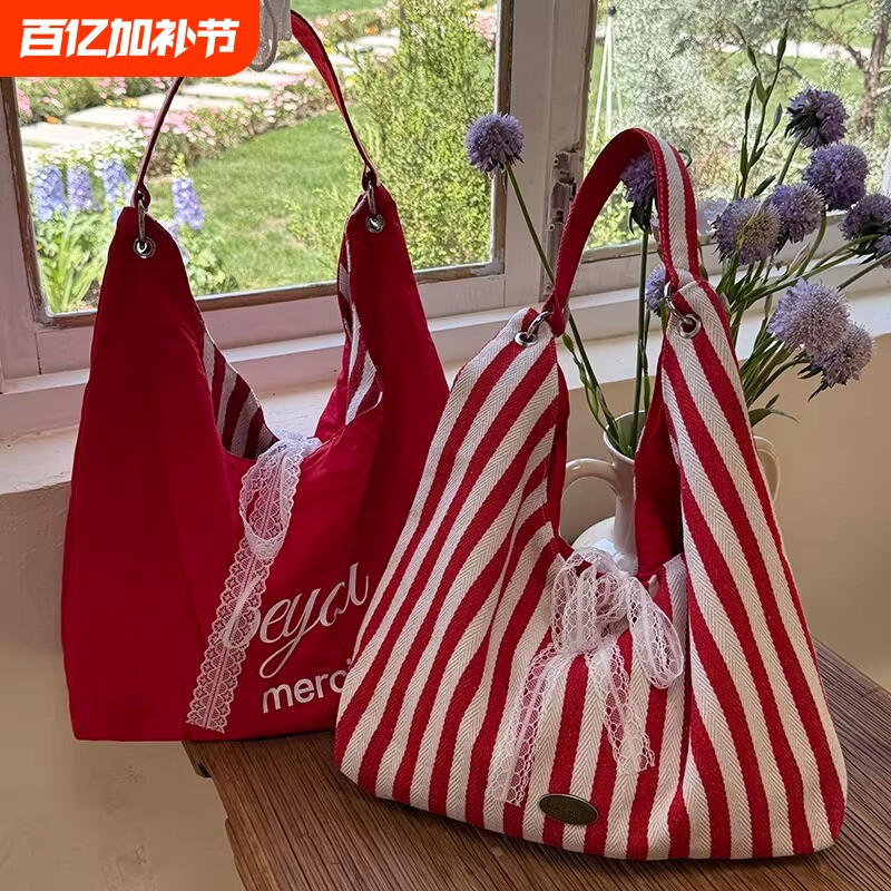 条纹帆布包包女夏天2025新款潮韩国字母印花双面单肩包学生上课包