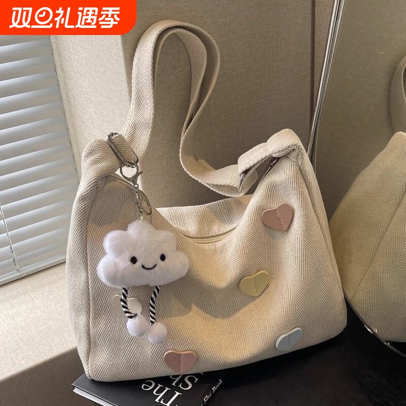 帆布包女2025新款潮秋冬简约百搭大容量单肩包休闲通勤斜挎饺子包