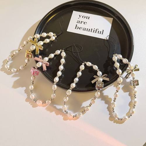 气质ins蝴蝶结仿手提链串珠饰品ccd相机手机挂绳轻奢百搭挂链