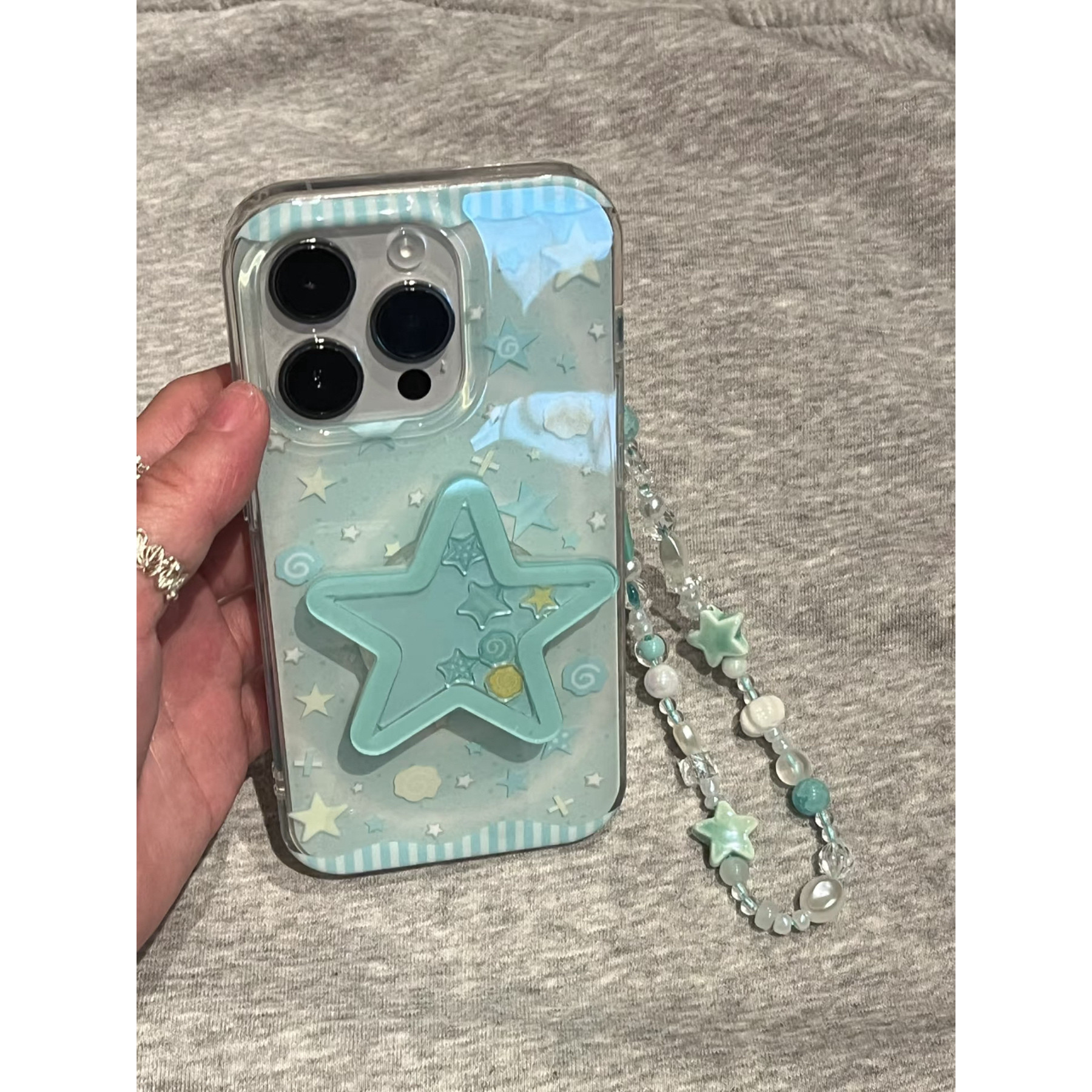 淡青晕染星星适用苹果16promax手机壳iPhone15/14plus带摇摇乐星星支架13pro男女oppo华为荣耀小米vivo硅胶壳