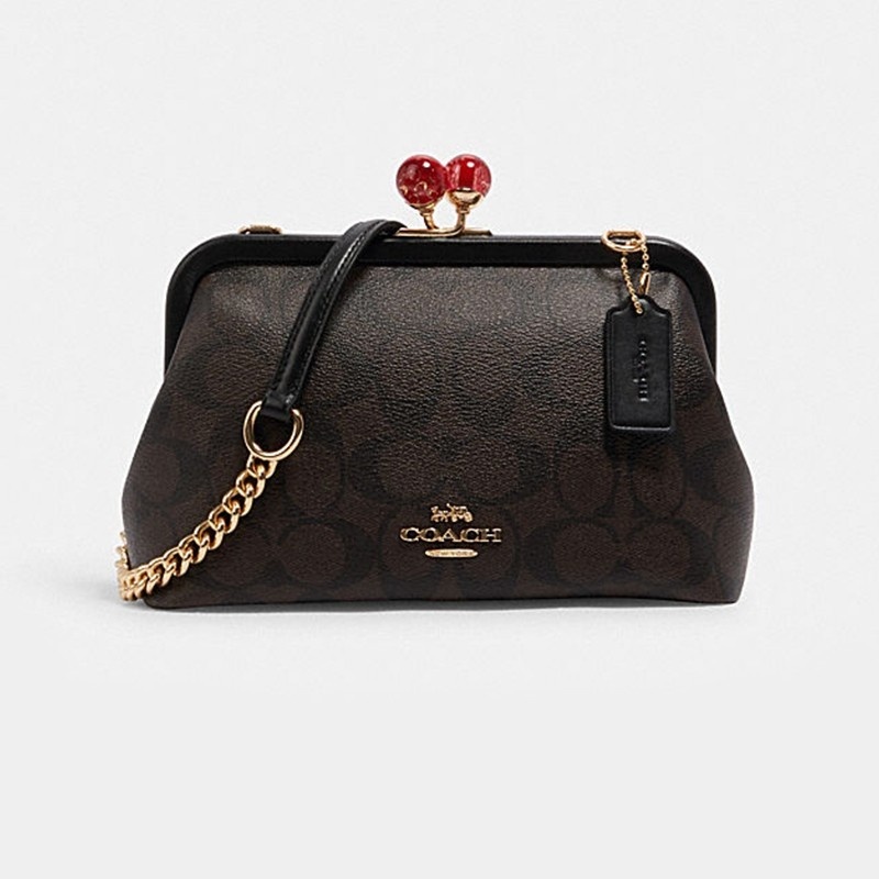 coach蔻驰女包款索吻斜挎包