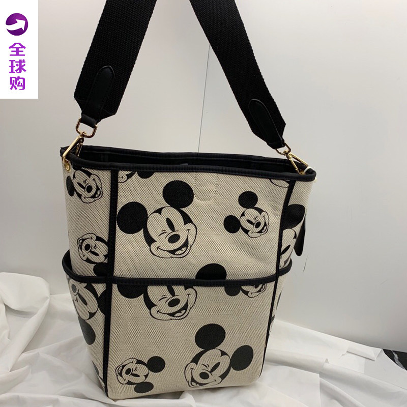 帆布洋气水桶包2024新款女包宽肩带单肩斜跨包印花大包休闲子母包