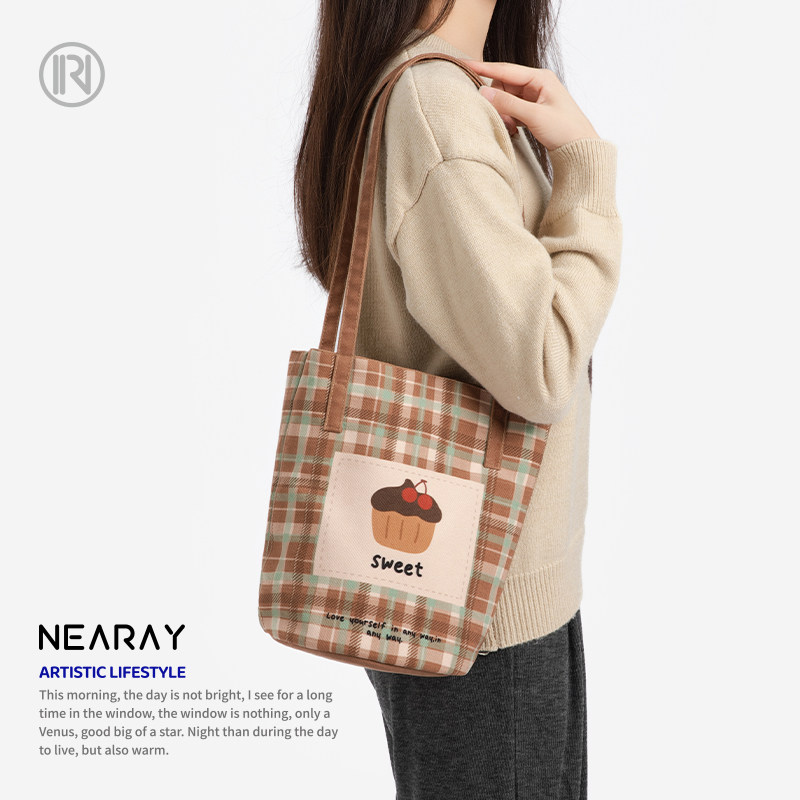 尼睿格纹小蛋糕甜美可爱水桶包