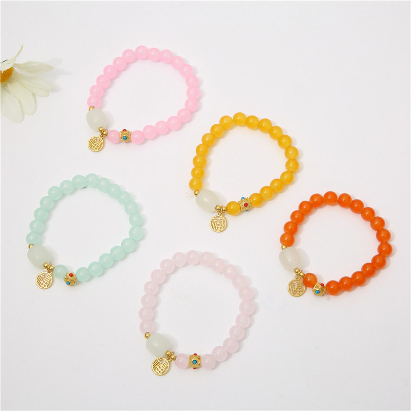 Crystal beaded bracelet with female lucky character charm