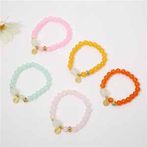 Crystal beaded bracelet with female lucky character charm