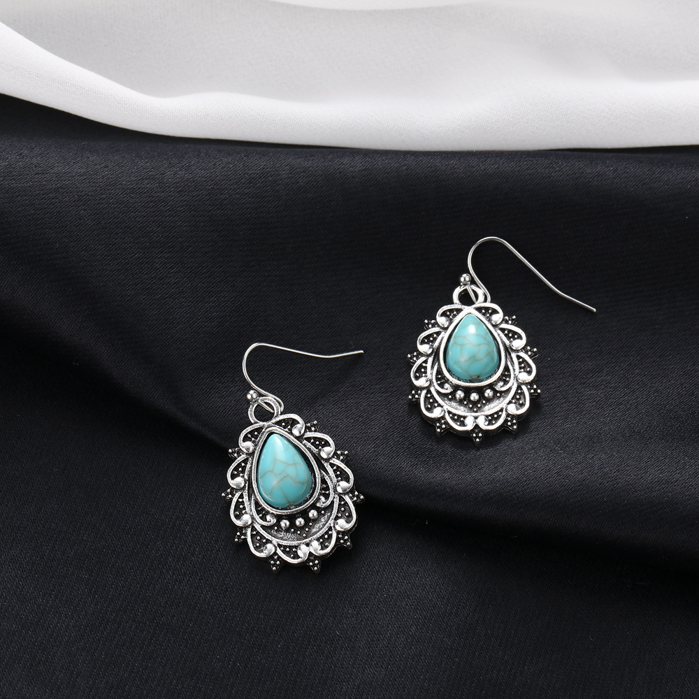 耳环New earrings with retro bohemian turquoise carved flower