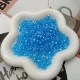 Небесно-голубые бусины из рогов разных размеров (50 г в пакетике)