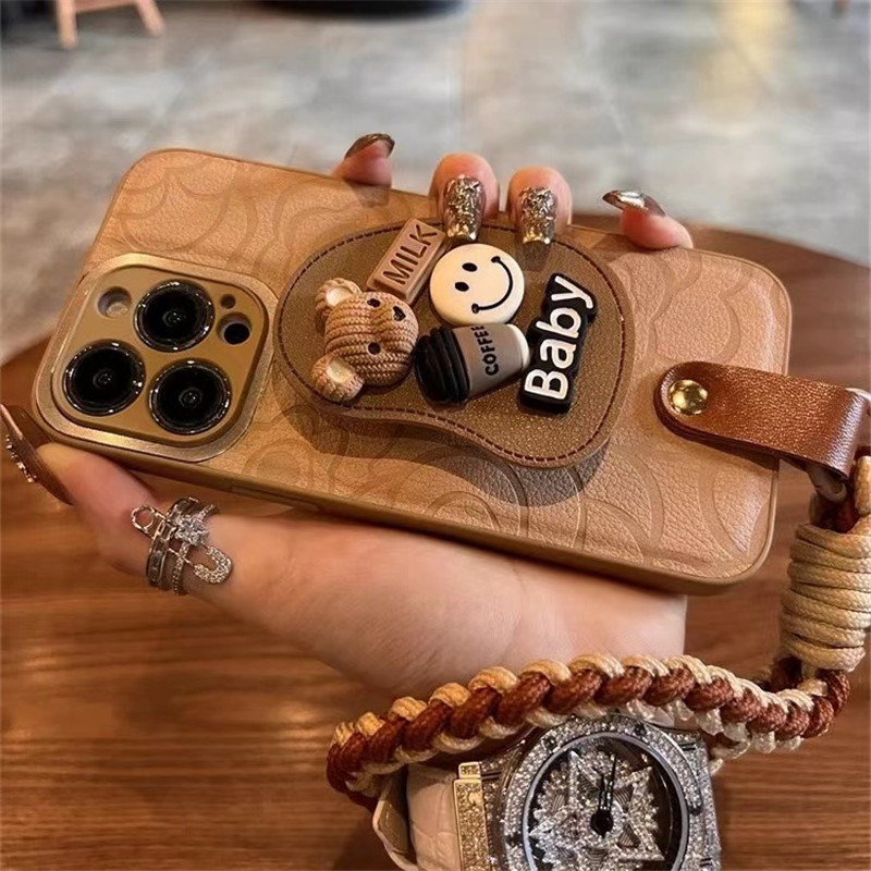 棕色山茶花小熊支架适用iPhone16ProMax手机壳苹果17高级感15小众14华为mate70网红p80pro+女荣耀400挂绳防摔