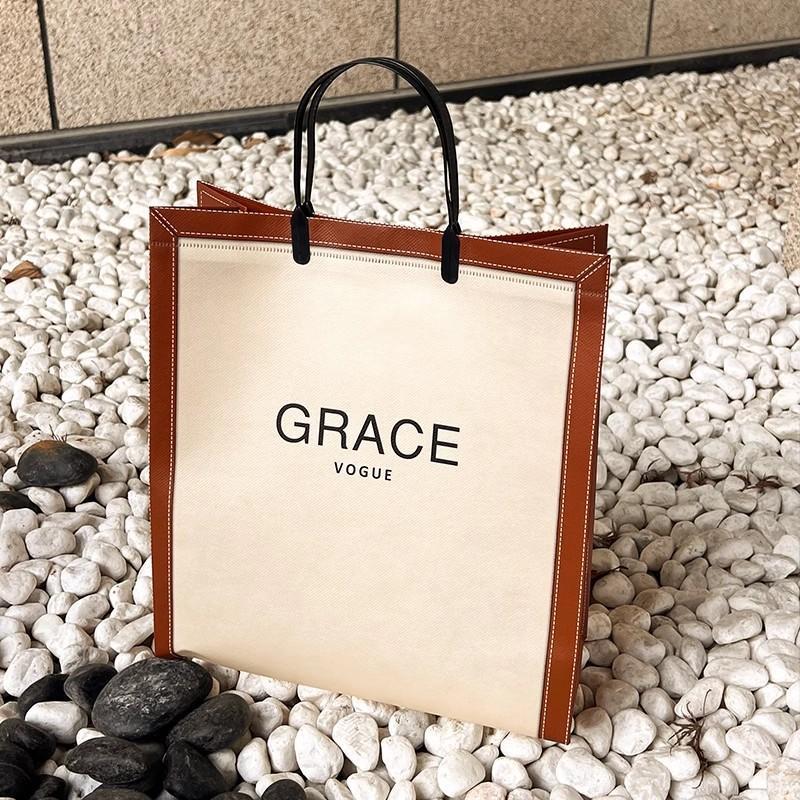 竖版无纺布覆膜服装店手提袋大号装衣服袋子外出时尚定购物袋爆款