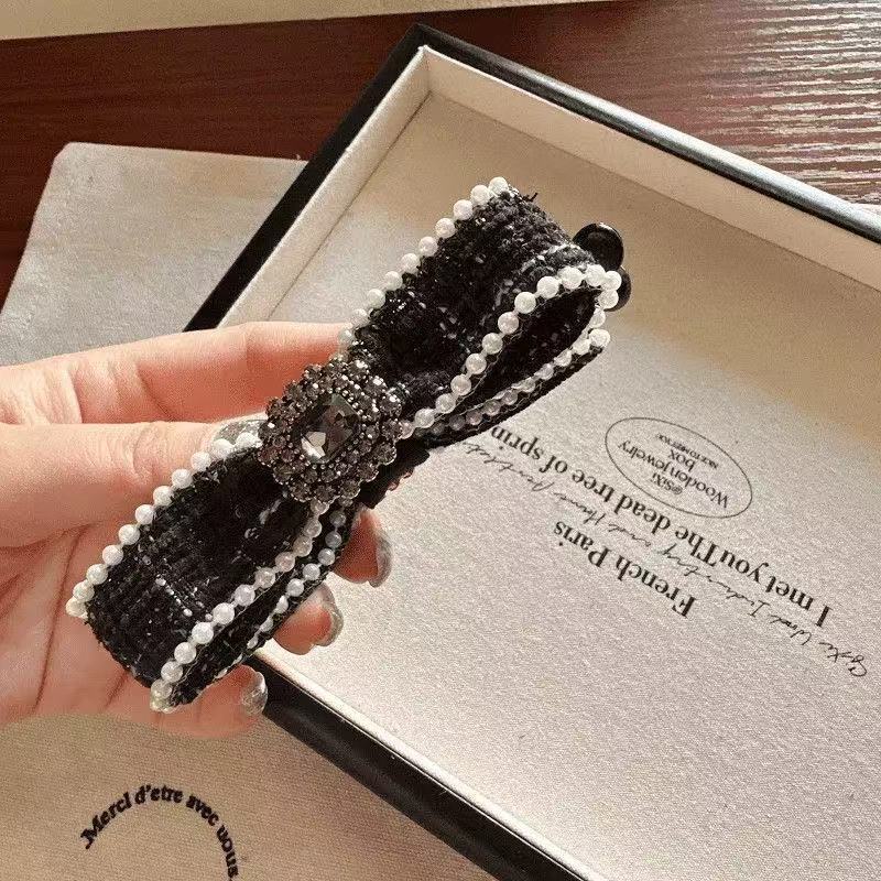 米色水钻蝴蝶结香蕉夹头饰