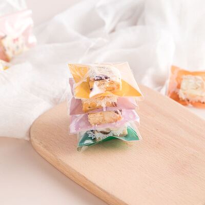 Pack 100 Cranberry biscuits in a single bag into a self seal