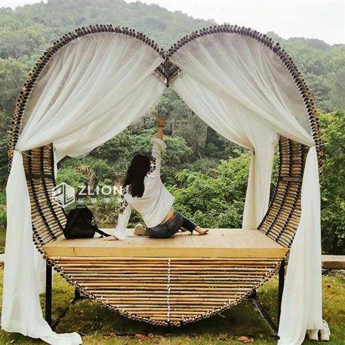 巴厘岛户外藤编网红创意爱心鸟巢秋千景区打卡婚纱拍摄道具圆形床