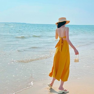 三亚多巴胺沙滩裙女海边度假性感露背长裙吊带胸垫黄色连衣裙超仙