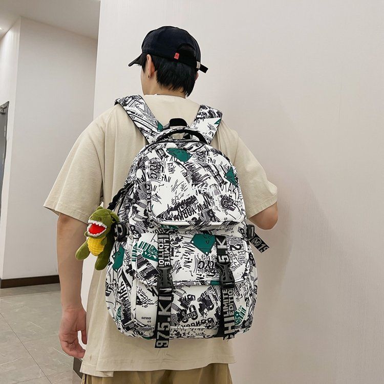 日韩潮版时尚涂鸦双肩包高中大学生男女学生书包帆布休闲旅行背包