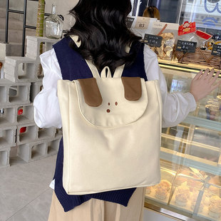 日系可爱小狗帆布双肩包2023新款卡通书包女学生上课通勤百搭背包