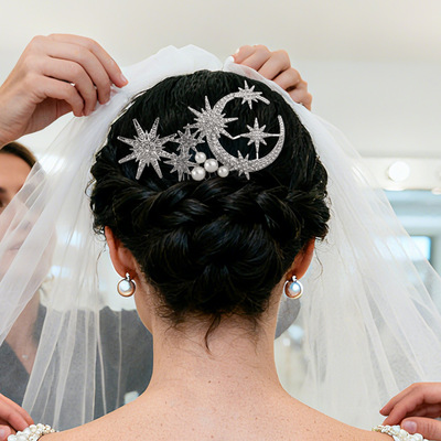 Luxurious bridal hair styling with rhinestone hair accessori
