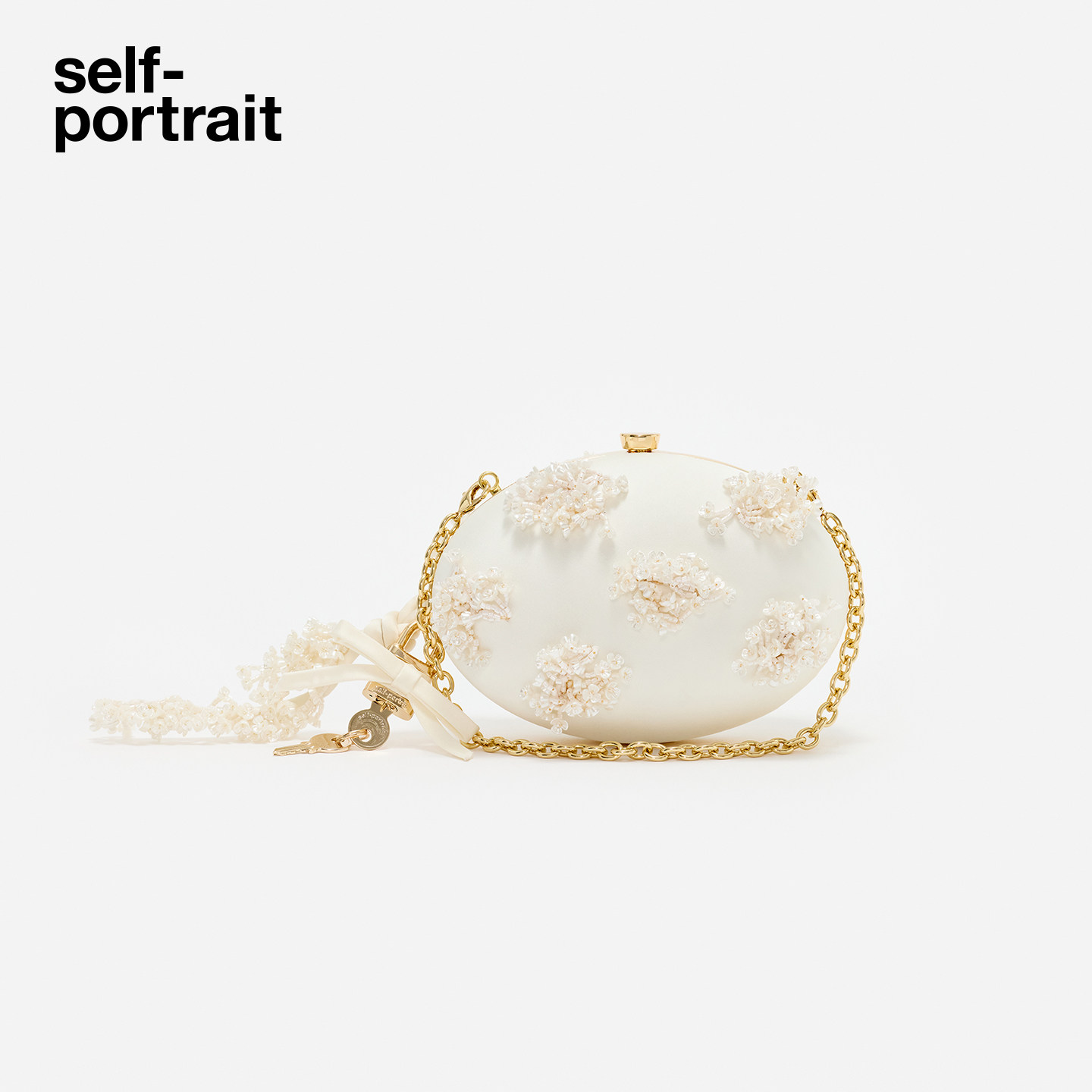 self-portrait 2026早秋新款象牙白花朵串珠链条蛋形手拿包