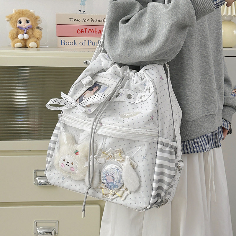 韩版卡通双肩包大容量潮搭背包通勤初高中学生轻便校园斜挎痛包女