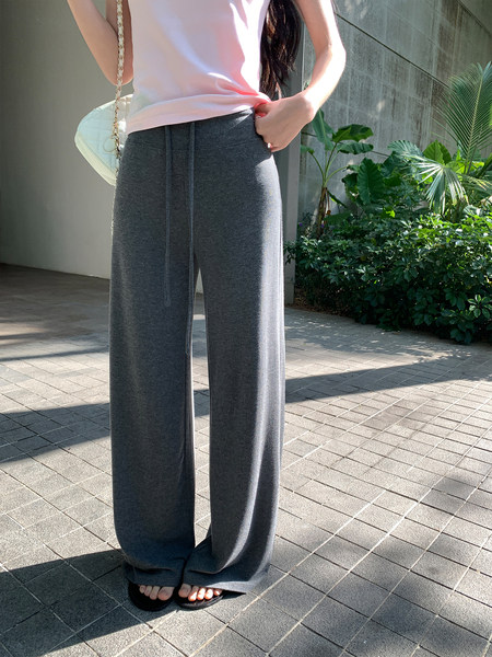 Gray wide-leg pants worn by a model outdoors