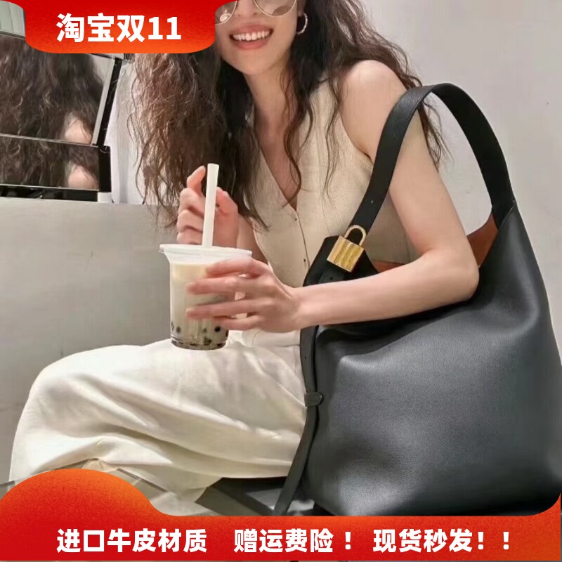 2026秋冬新款真皮托特包大容量锁头水桶包慵懒风单肩斜挎通勤大包