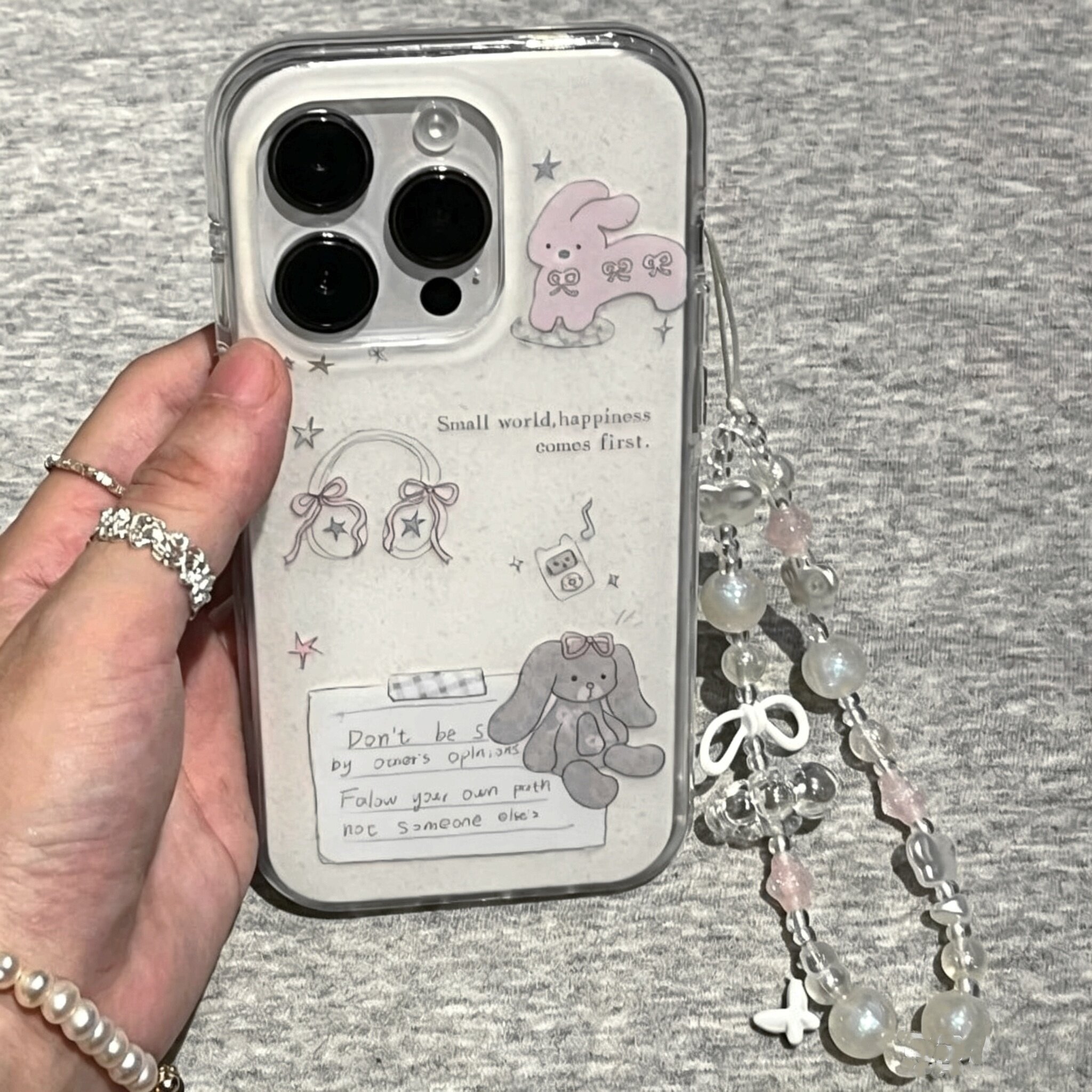 适用苹果系列iPhone17新款手机壳16promax/14pro卡通磨砂耳机兔子15promax/13pro半包大孔防摔网红女款保护套