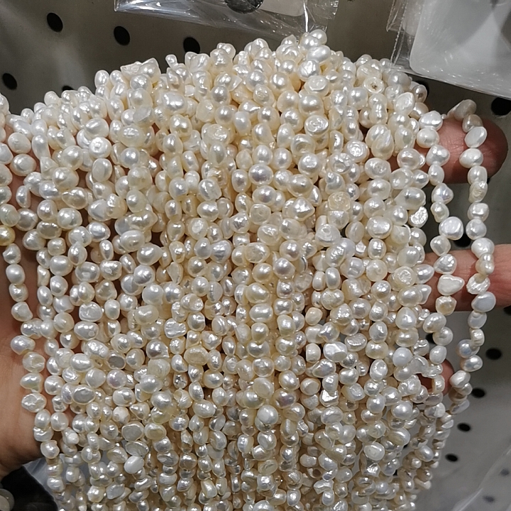 5-6mm测孔三七孔两面光异形天然淡水珍珠散珠项链半成品一条