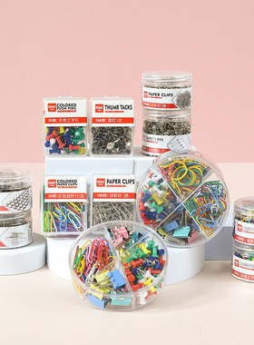 Colored boxed paper clips, pushpins, and silver barrel pins