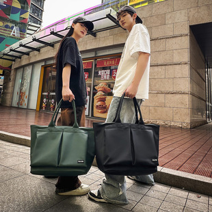 单肩包男款大容量学生通勤休闲男士纯色新款包包女旅行包手提包潮
