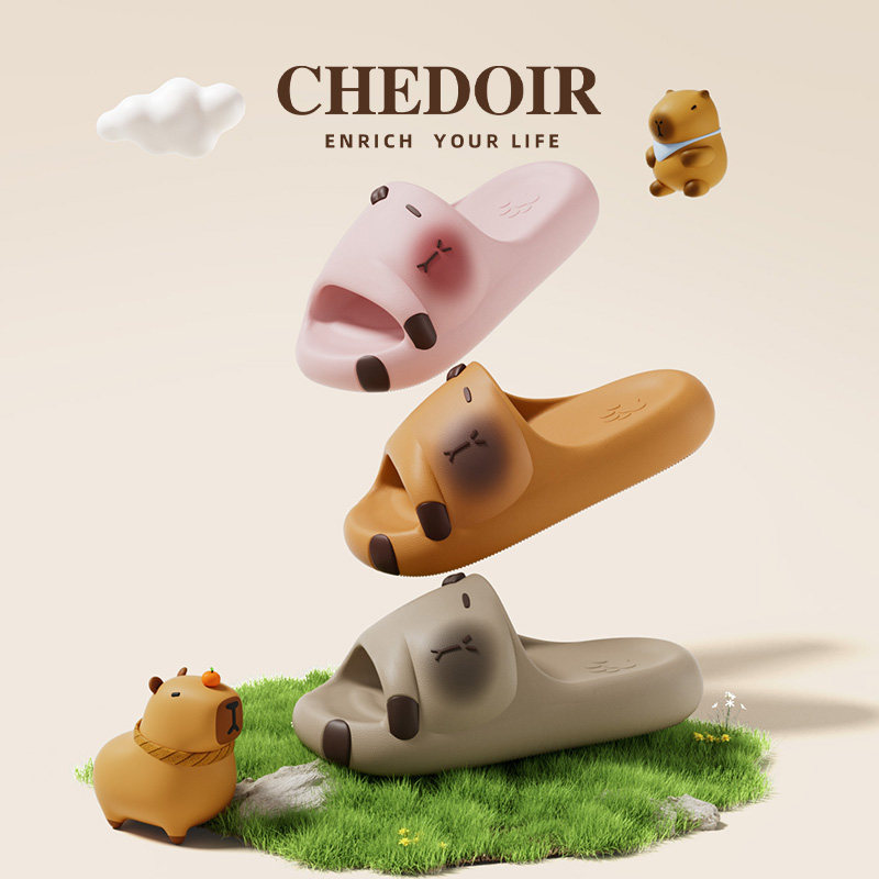 Cute bear-shaped slip-on slippers in pink, tan, and gray displayed on a simple background