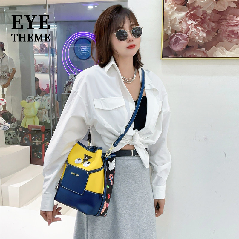 EYE THEME黄色拼接女士休闲新潮流街头手提包印花斜跨搞怪水桶包