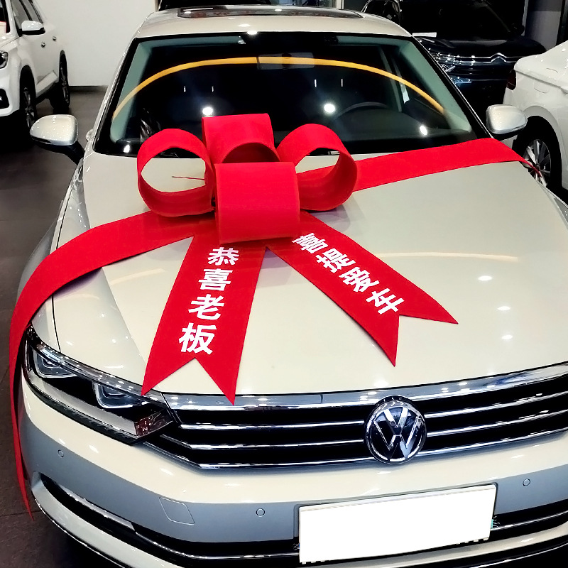 交车蝴蝶结拉花汽车4S店展厅布置