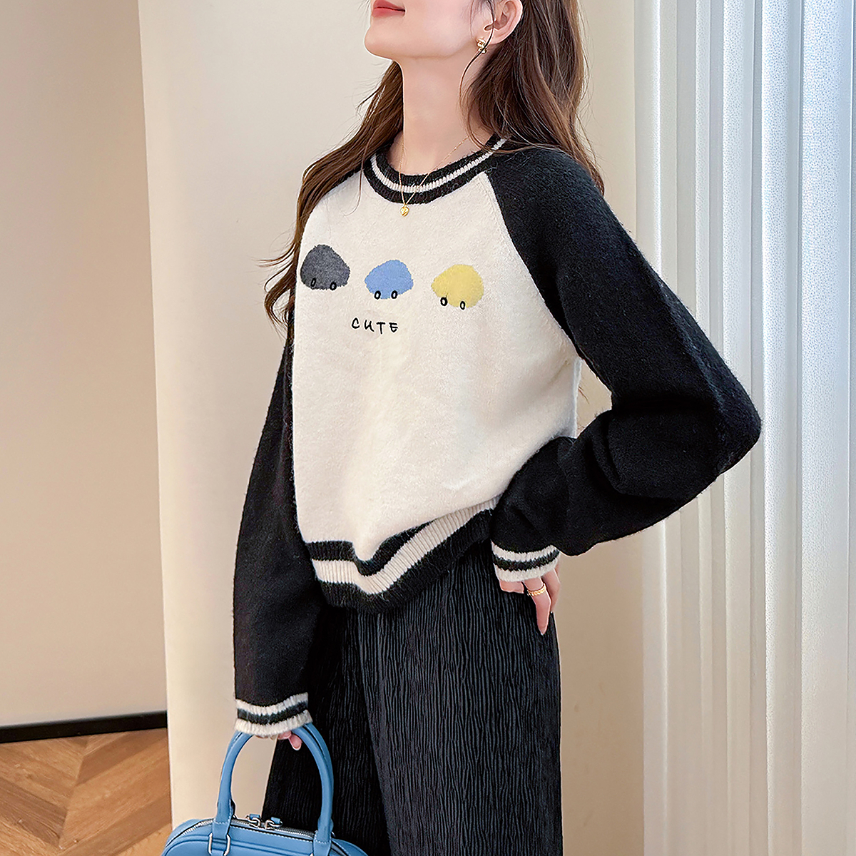 唐狮秋冬毛衣女时髦潮流撞色插肩