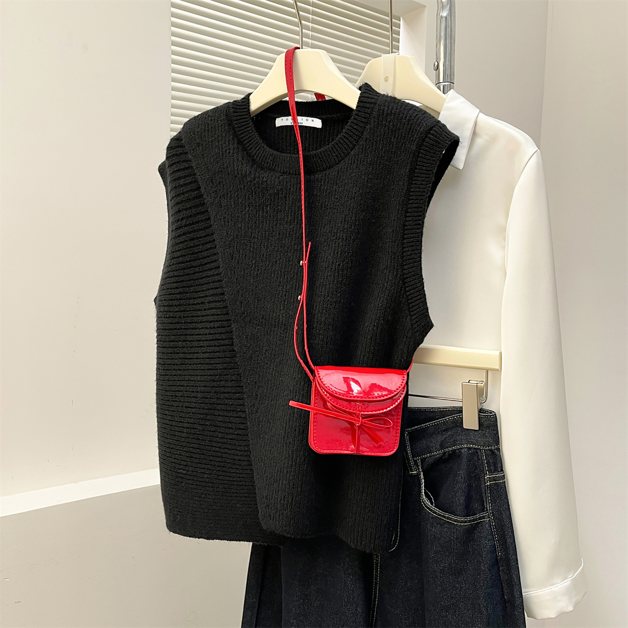 唐狮秋冬季女毛衣设计感不规则开