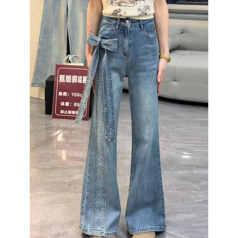 蓝色满天星闪钻微喇牛仔裤女2026年春季新款时尚蝴蝶结直筒喇叭裤图片