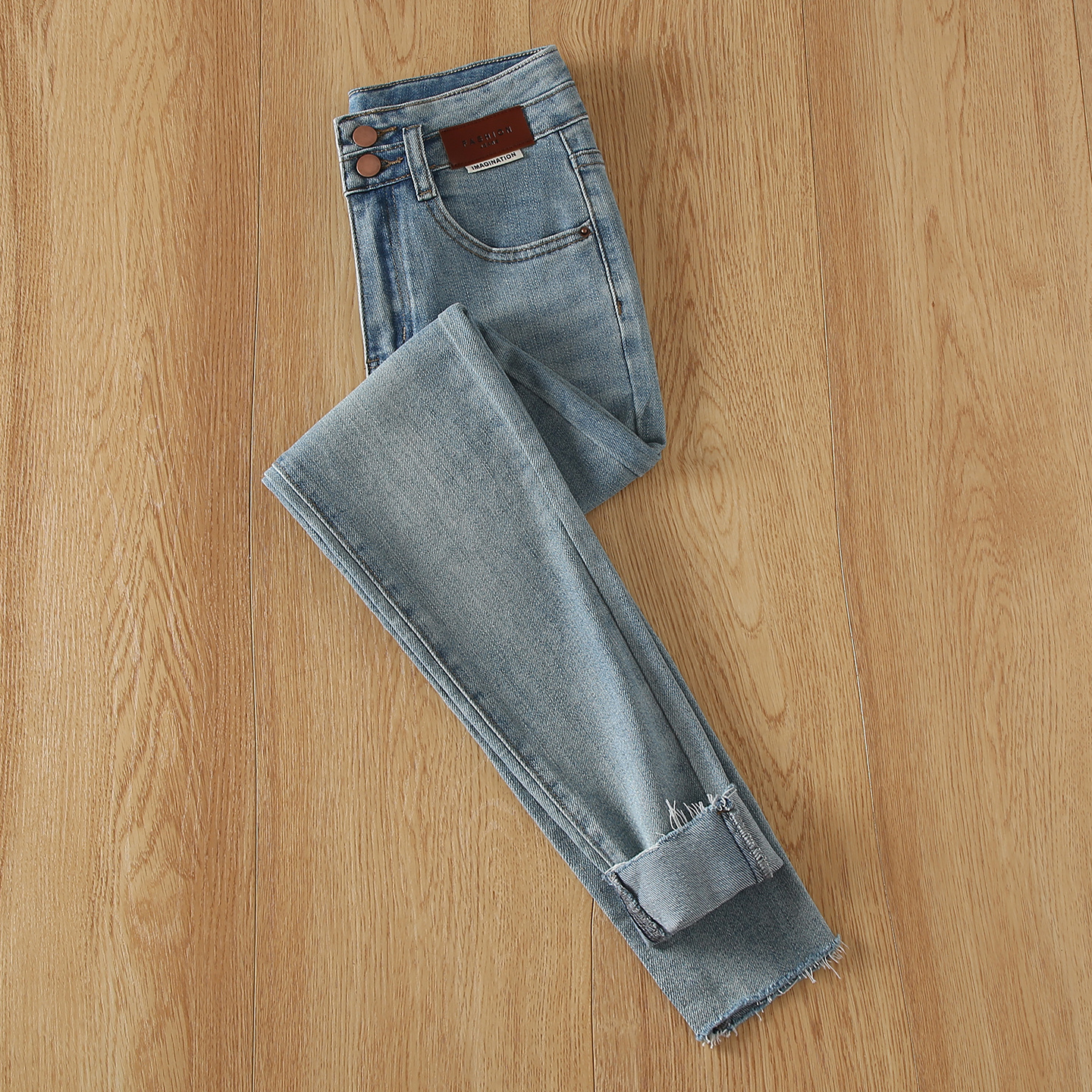 拉夏贝尔浅蓝色紧身小脚牛仔裤秋