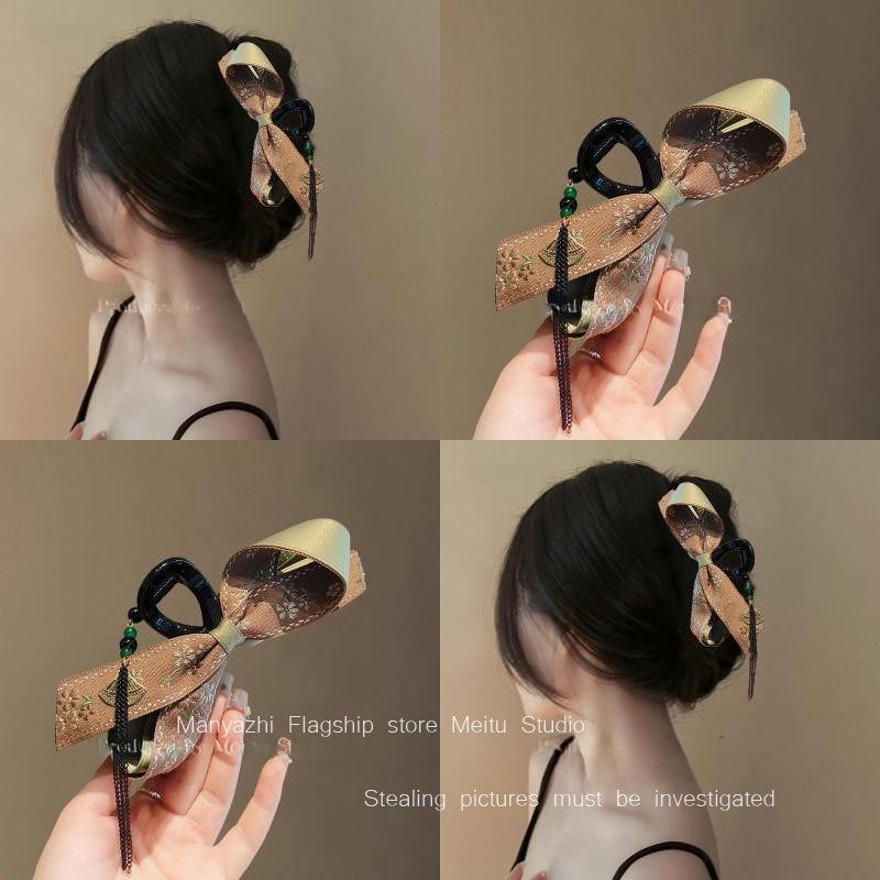 堅果殼棕雙面蝴蝶結流蘇鯊魚夾女