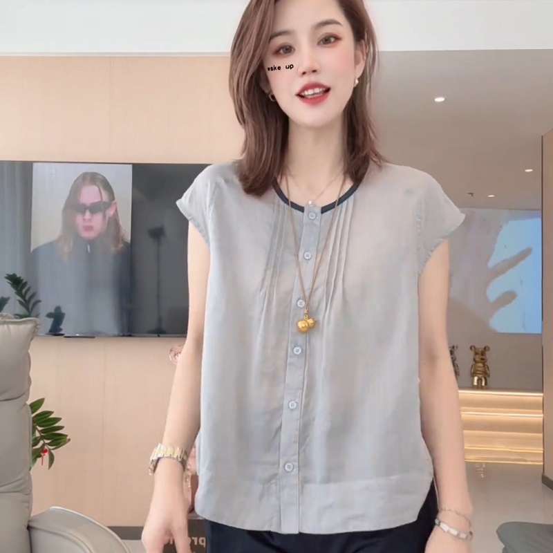 法式复古高级感圆领无袖衬衫女2025夏季新款设计感小众单排扣上衣