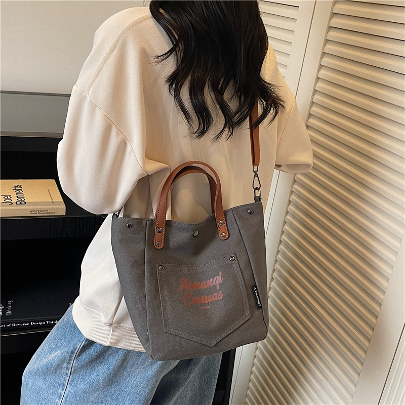 ins简约复古休闲手提包包女小众设计字母帆布包百搭轻便斜挎包