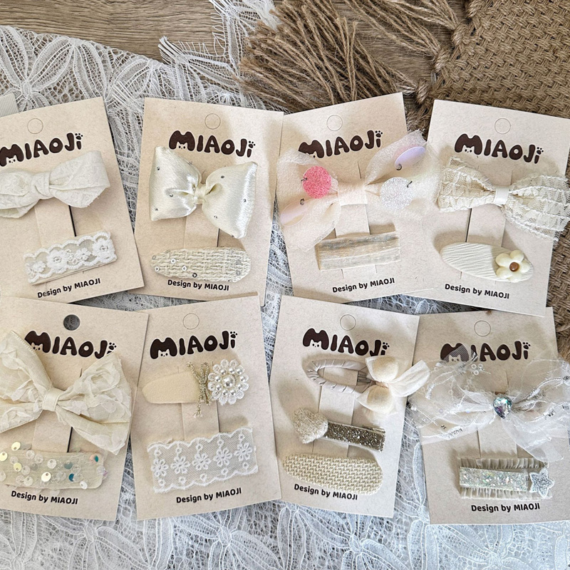 奶白蕾丝蝴蝶结花朵儿童发夹对装