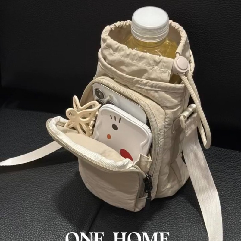 多巴胺可斜挎水杯包2025新款外出遛弯便携大容量手机包防水水壶包