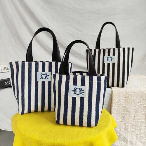 新款手拎包百搭帆布收纳袋水桶包