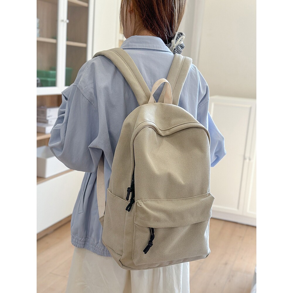 日本进口耐磨水洗帆布双肩包女简约大容量初高中大学生书包男休闲