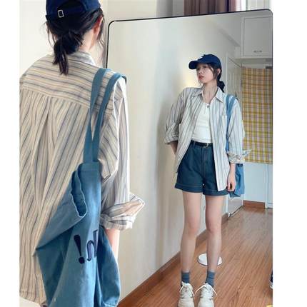 蓝色条纹长袖衬衫女夏季2025新款薄款防晒衬衣开衫设计感小众上衣