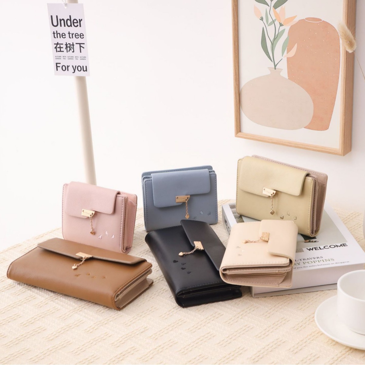 日本品质长款钱包女新款2025爱心印花五金吊坠简约大气三折多卡位