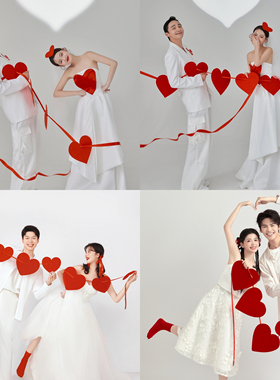 红色爱心串礼服搭配心形拉绳领证登记婚礼手持创意情侣拍照道具